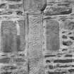 View of Pictish symbol stones and cross-shaft built into gable of  Fyvie Church.