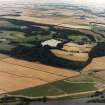 General oblique aerial view centred on the country house, stable, laundry, offices, museum and lake, taken from the SW.