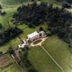 Oblique aerial view centred on the country house with walled garden adjacent, taken from the E.