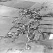 Oblique aerial view centred on the village of Stichill, taken from the NE.
