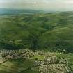General oblique aerial view looking over Menstrie village towards Menstrie Glen, taken from the SSE.