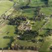 Oblique aerial view centred on the country house, stables and walled garden with the gate-lodge adjacent, taken from the NW.