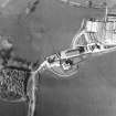 Oblique aerial view centred on the farmstead with the site of the well adjacent, taken from the SW