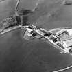 Oblique aerial view centred on the farmstead with the site of the well adjacent, taken from the SSE