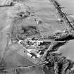 Oblique aerial view of Kirkcudbright training area centred on Girdstingwood Headquarters, taken from the ESE.