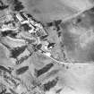 Oblique aerial view centred on tower house from S.