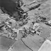 Oblique aerial view, taken from the NE, centred on the village.