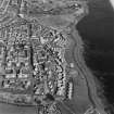 Oblique aerial view of Buckhaven centred on the Old Buckhaven housing redevelopment designed by Wheeler and Sproson in 1964-73, and recorded as part of the Wheeler and Sproson Project.  Taken from the SW.