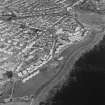Oblique aerial view of Buckhaven centred on the Old Buckhaven housing redevelopment designed by Wheeler and Sproson in 1964-73, and recorded as part of the Wheeler and Sproson Project.  Taken from the SSW.