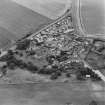 Oblique aerial view of the village of Kilrenny centred on the church, taken from the NNE.