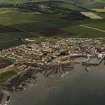 Oblique aerial view of St Monance centred on the village, church and harbour, taken from the S.
