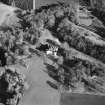 Oblique aerial view centred on the castle and tower-house, taken from the W.