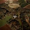 Oblique aerial view centred on the castle and tower-house, taken from the SW.