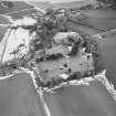 Oblique aerial view centred on the remains of the castle taken from the NW.