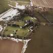 Oblique aerial view centred on the remains of the castle taken from the W.