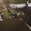 Oblique aerial view centred on the remains of the castle taken from the SW.