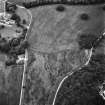 Oblique aerial view from South East of Gordon Castle estate (after demolitions), including laundry cottages and cropmarks
