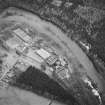 Oblique aerial view centred on the whisky distillery, taken from the NW.