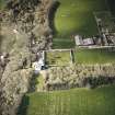 Oblique aerial view centred on the country house and walled garden with the farmsteading adjacent, taken from the S.