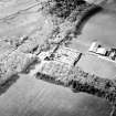 Oblique aerial view centred on the country house and walled garden, taken from the SE.