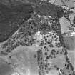 Castle Leod.
Oblique aerial view, taken from the SE, centred on the tower-house. A possible golf course is visible in the bottom left-hand corner of the photograph.