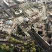 Oblique aerial view of Edinburgh centred on the Clydesdale Bank Plaza, Lothian Road, with the construction of Exchange Crescent adjacent, taken from the NE.