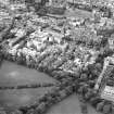 Oblique aerial view centred on the hospital with the school adjacent, taken from the SE.