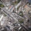 Oblique aerial view of Leith centred on Great Junction Street and Crabbies Winery, taken from the S.