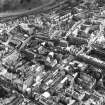 Aerial view showing South Bridge at bottom of photograph, St Mary's Street to left, Holyrood Park at top and Old College to right