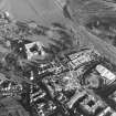 Oblique aerial view centred on the construction of the Scottish parliament, taken from the WNW.