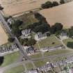 Dalmeny village and Dalmeny Parish Church, oblique aerial view.