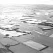 Oblique aerial view of East Fortune Airfield centred on the airfield, taken from the NW.
