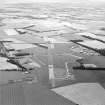 Oblique aerial view of East Fortune Airfield centred on the airfield, taken from the WNW.