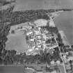 Oblique aerial view centred on the hospital, taken from the SSE.
