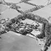 Oblique aerial view centred on the hospital, taken from the NE.
