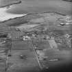 Hoy, Lyness, oblique aerial view, taken from the SSW, centred on the Royal Navy Oil Terminal, and showing the Naval Cemetery in the centre left of the photograph.