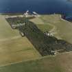 Oblique aerial view of Orkney, Shapinsay, Balfour Castle and walled garden, Balfour village, harbour with the Dishan Tower dovecot, taken from the WNW.