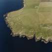 Oblique aerial view of Orkney, South Ronaldsay, Hoxa Head, First World War coastal battery and the Second World War Balfour Battery taken from the SW.  Also visible are the concrete hut bases of the accommodation camp.