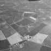 Aerial view of Orkney, Sandwick, taken from the SW, Skeabrae airfield, runways, perimeter track and bomb store.