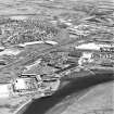 Aerial view of Irvine Harbour, the Scottish Maritime Museum (including SV Carrick), the sawmill, Ayrshire Metal Products and Portland Road glass works, taken from the NW.