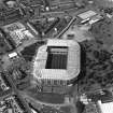 Glasgow, Parkhead, oblique aerial view, taken from the SE, centred on Celtic Park football stadium, and showing the Eastern Necropolis graveyard in the centre right of the photograph.