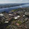 General oblique aerial view of Dumbarton looking across the school and whisky distillery towards the River Clyde, Langbank and Port Glasgow, taken from the ENE.