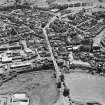 Aerial view of Galston road bridge, Church Lane Lace Mill, Barrmill Road Lace Factory, Barr Castle, and Bentinck Street Church, taken from NNE.