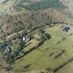 Oblique aerial view centred on the tower-house with the stables and kennels adjacent, taken from the N.