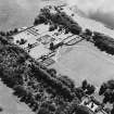 Oblique aerial view of Kinross House country house with garden, gate, stables and church and burial ground visible, taken from the NNW.