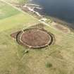 Aerial view of the Ring of Brodgar, henge and stone circle, taken from the SW.  Also visible are some of the surrounding cairns.
