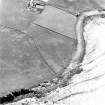 Oblique aerial view of Sanday, Boloquoy, farmsteading and watermill taken from the NW.  Also visible is an enclosure and bank