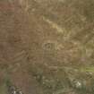 Oblique aerial view centred on the remains of the stone circle, taken from the W.