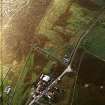 Oblique aerial view centred on the standing stone, taken from the NNE.