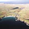 General oblique aerial view looking across the harbour, crofting township and lazy beds towards the townships, taken from the ESE.